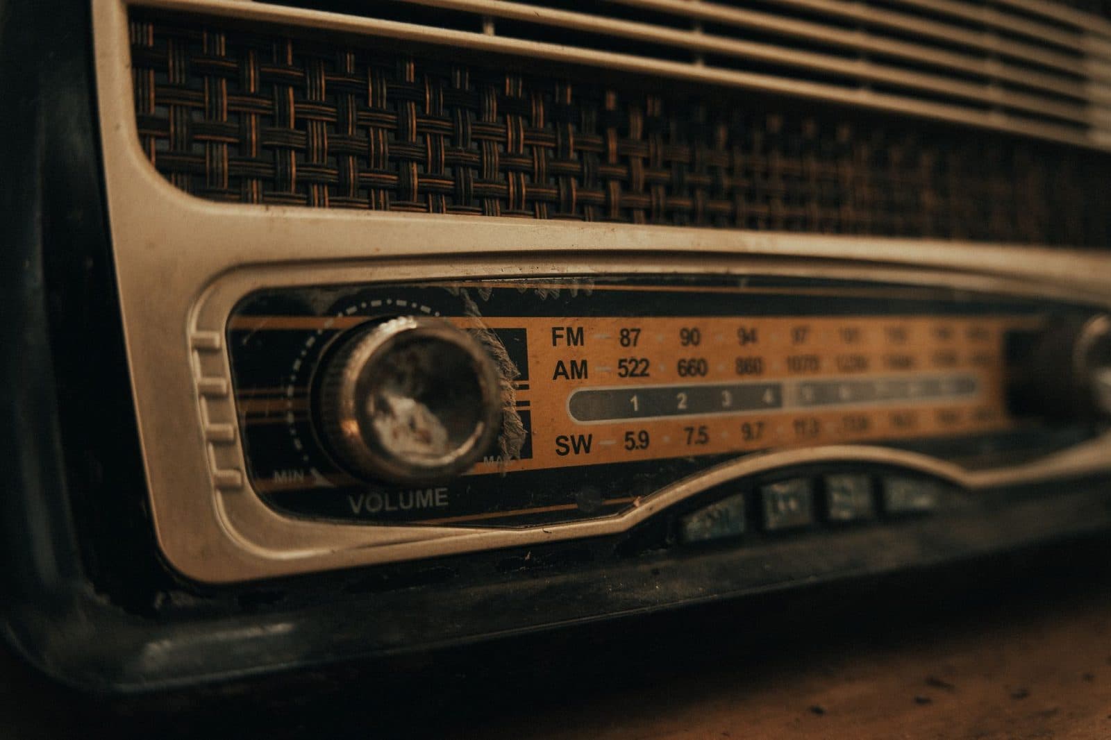 Detailed close-up of a vintage radio dial with nostalgic elements and textured design.