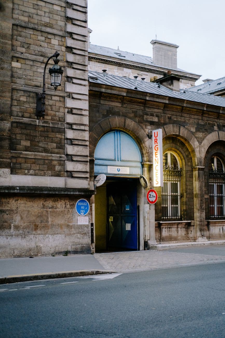 Classical architecture featuring an emergency entrance in an urban environment.