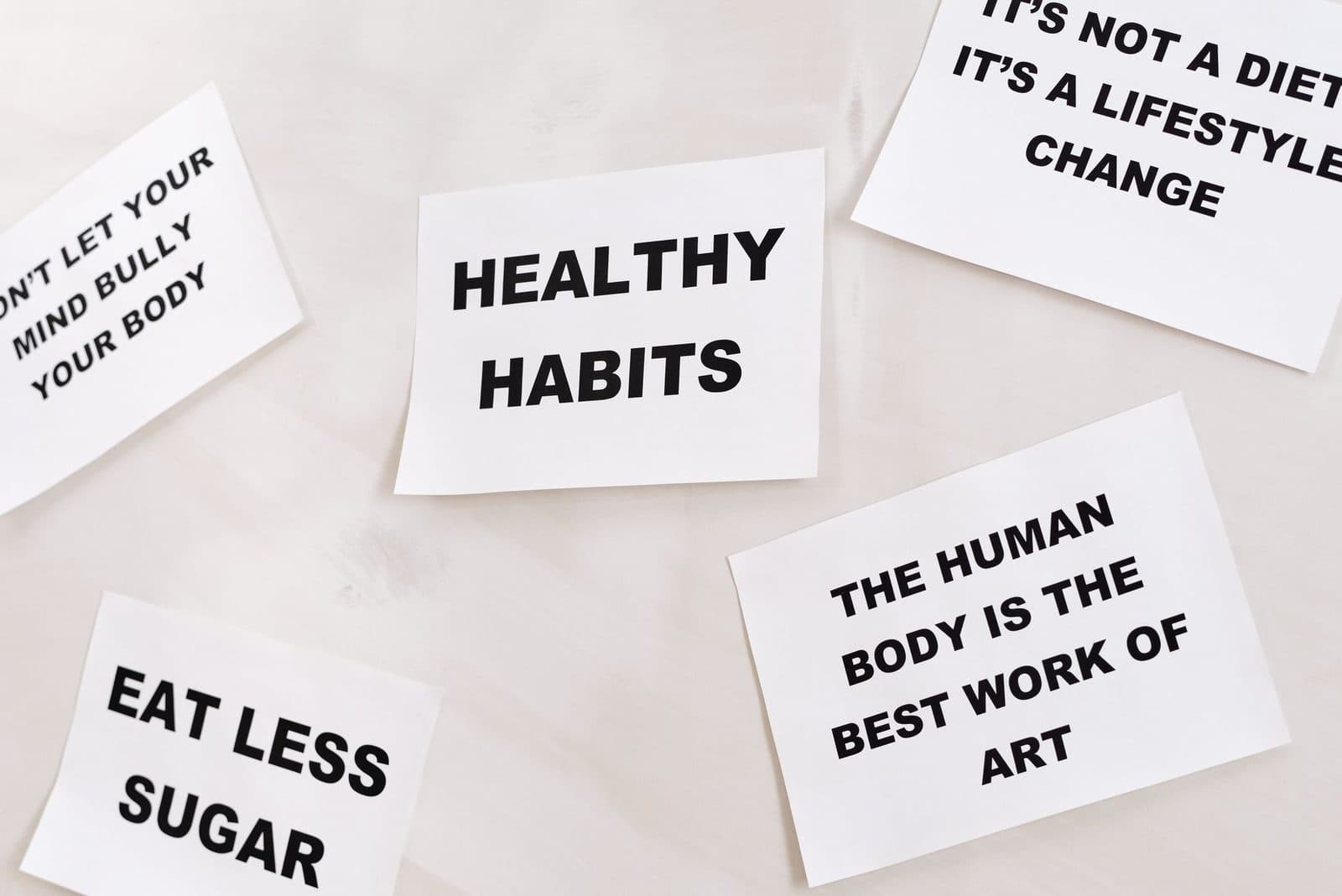 Motivational cards promoting healthy habits and positive thinking for lifestyle change.