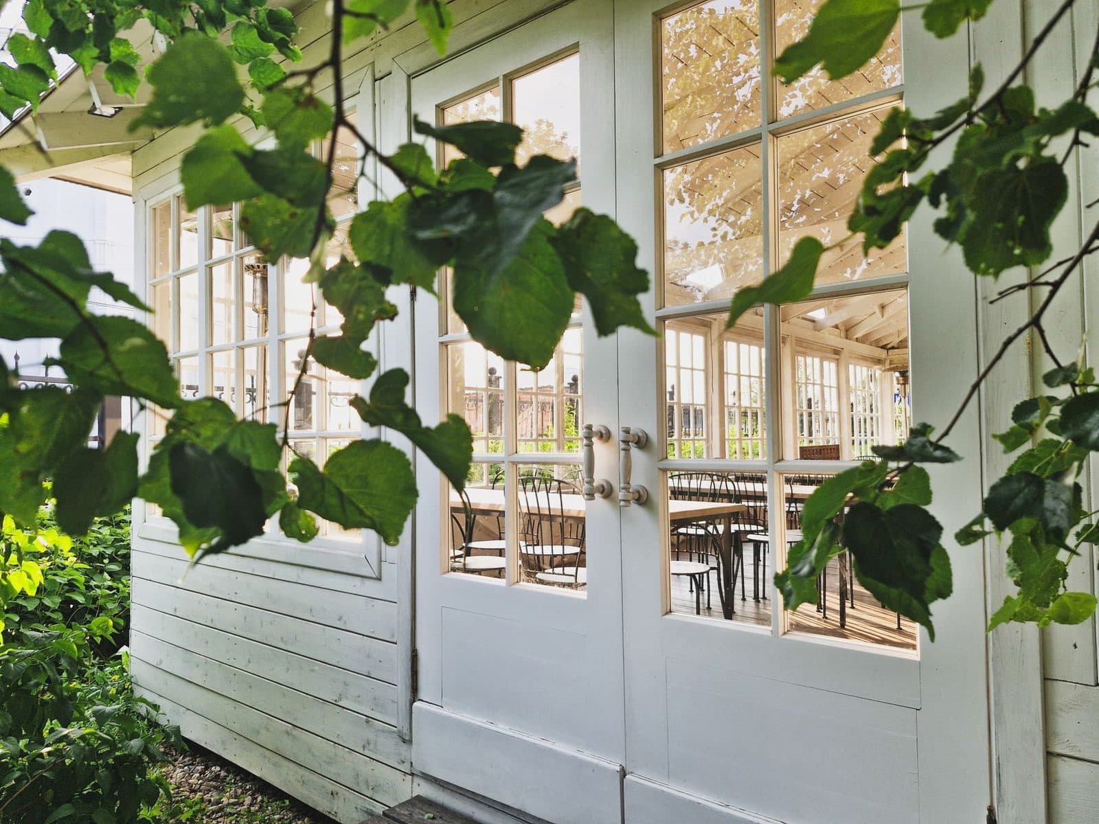 Elegant garden terrace in Sergiyev Posad with inviting glass doors, offering a quaint and serene retreat.