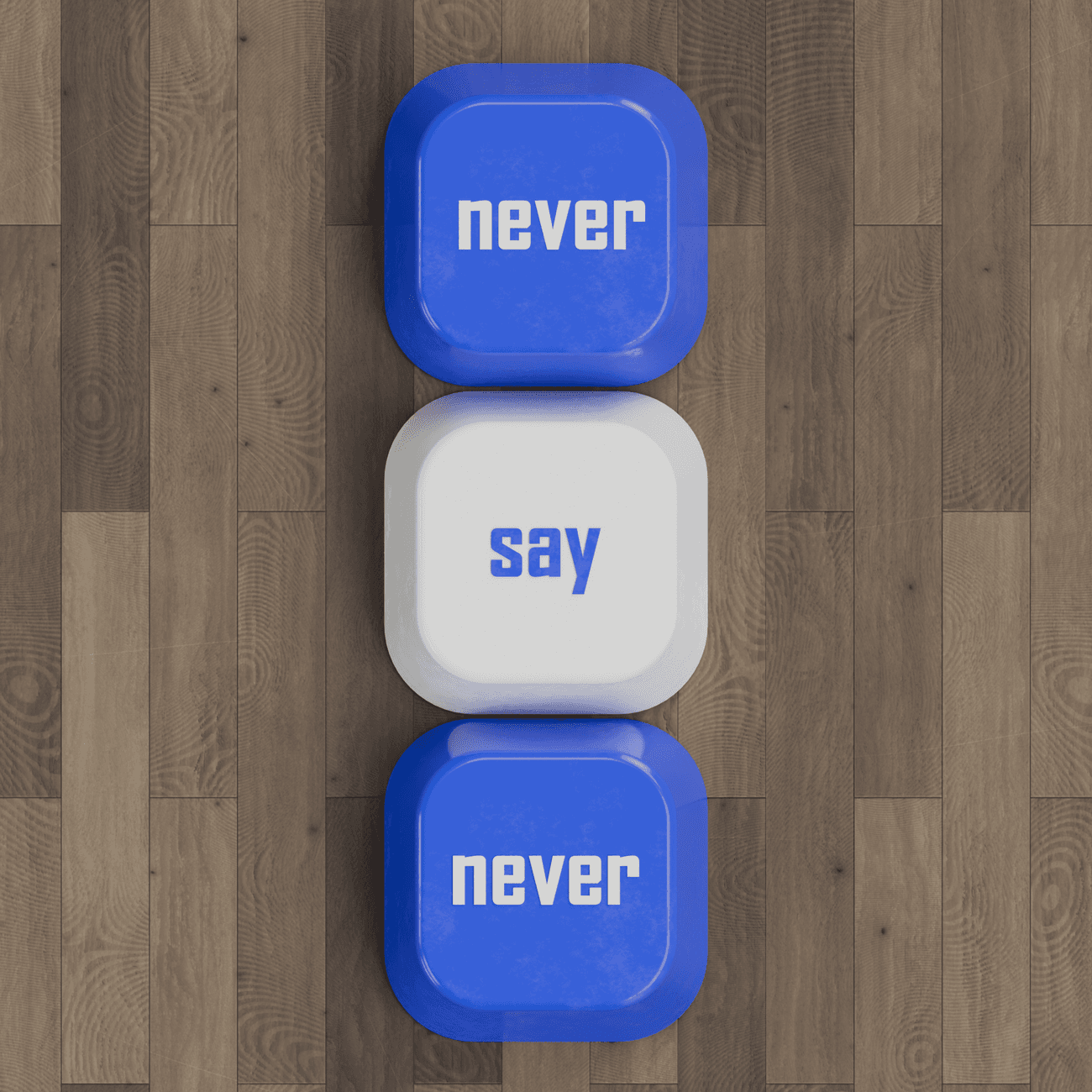 Top view of keyboard tiles spelling 'never say never' on wooden floor.