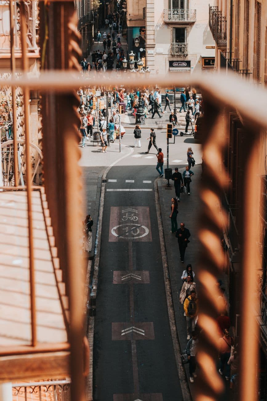 A bustling street in Barcelona, Spain, captured with dynamic city life and historical architecture.